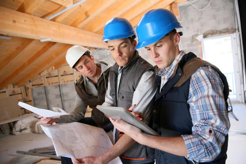 construction manager with workers checking on site